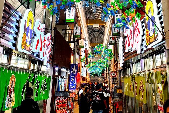 Hungry Osaka Street Food Tour:15 Tastings & 3 Drinks with a Local - The Walking + History Piece: Tsutenkaku, Western Influence, and Local Customs