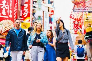 Osaka: 2-Hour Nightlife District Walking & Local Food Culture - Dotombori Glico Sign: Neon Energy and Your First Snack Opportunity