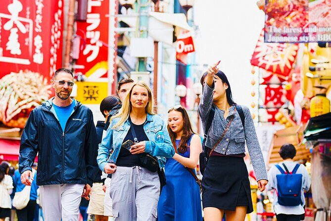 Osaka: 2-Hour Nightlife District Walking & Local Food Culture - Dotombori Glico Sign: Neon Energy and Your First Snack Opportunity