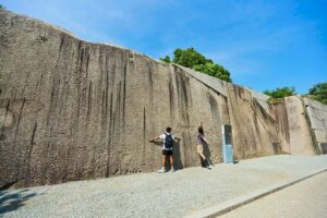 Osaka Castle Walking Tour and Castle Tower Admission - Osaka Castle main area: defenses, walls, gates, and the big-stone lesson