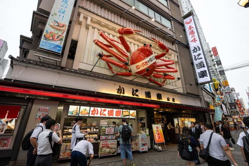 Osaka: Food Tour Kuromon Market & Dotonbori with Guide - Egg Tart Finale: Flaky Crust Meets Custard Creaminess