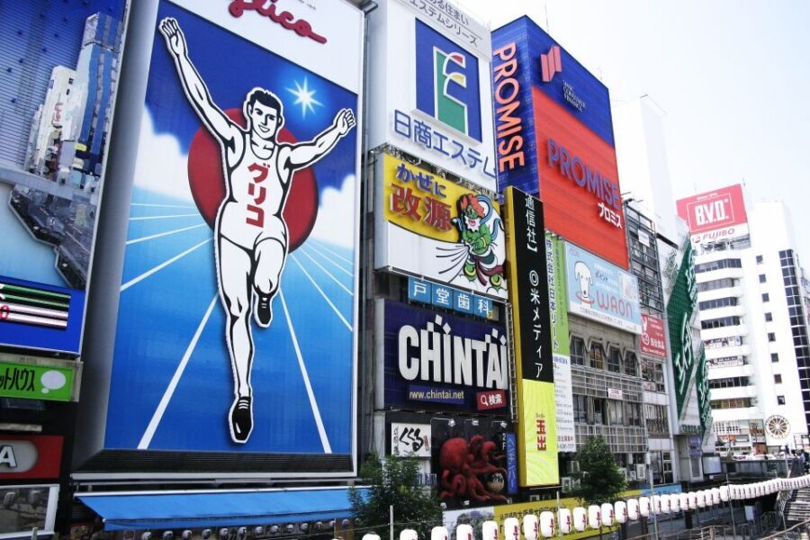 Osaka: Full-Day Sightseeing Tour by Private Vehicle - Shinsekai: Osaka street culture, food energy, and old-school games