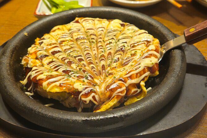 Osaka: Shinsekai Food Tour - 13 Dishes at 5 Local Eateries - Stop 2: Shinsekai streets, neon signs, and Tsutenkaku energy
