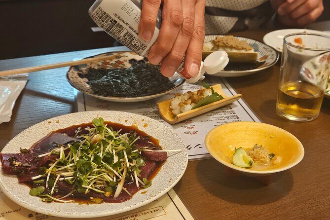 Osaka: Shinsekai Food Tour - 13 Dishes at 5 Local Eateries - Stop 4: Tsutenkaku Tower, photos and a final snack glow